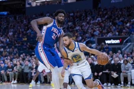 Jan 30, 2024; San Francisco, California, USA;  Golden State Warriors guard Stephen Curry (30) drives against Philadelphia 76ers center Joel Embiid (21) during the fourth quarter at Chase Center. Mandatory Credit: Neville E. Guard-USA TODAY Sports