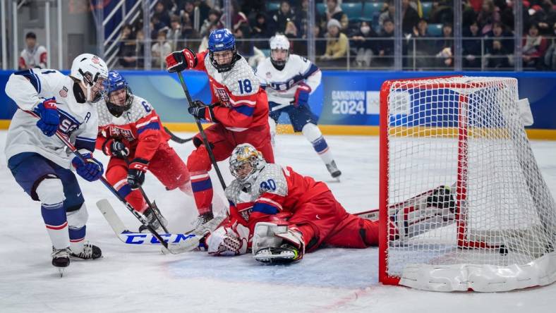 Jan 31, 2024; Gangwon-do, KOR; Mikey Berchild (USA) strikes the puck past goalkeeper Jan Larys (CZE) to score a goal and make it 0-3 in the Ice Hockey Men s 6-on-6 Tournament Gold Medal Game between Czech Republic and (USA) at the Gangneung Hockey Centre. The Winter Youth Olympic Games, Gangwon, South Korea, Wednesday 31 January 2024. Mandatory Credit: OIS/Joe Marklund-USA TODAY Sports