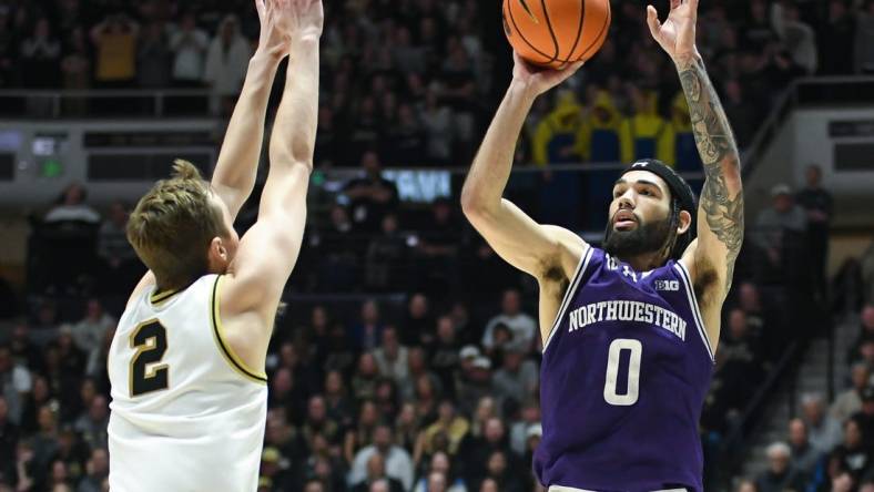 Jan 31, 2024; West Lafayette, Indiana, USA; Northwestern Wildcats guard Boo Buie (0) attempts a shot over Purdue Boilermakers guard Fletcher Loyer (2) during the first half at Mackey Arena. Mandatory Credit: Robert Goddin-USA TODAY Sports