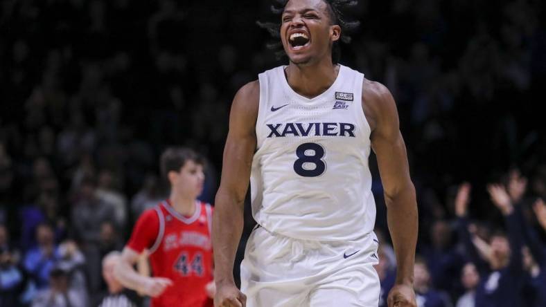 Jan 31, 2024; Cincinnati, Ohio, USA; Xavier Musketeers guard Quincy Olivari (8) reacts after making a 3-point basket against the St. John's Red Storm in the second half at Cintas Center. Mandatory Credit: Katie Stratman-USA TODAY Sports