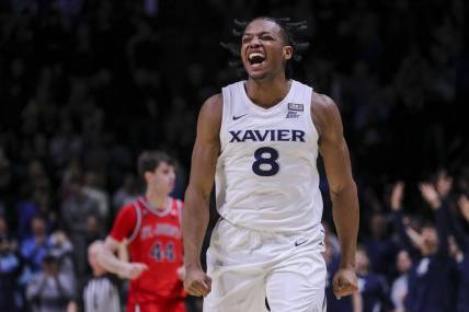 Jan 31, 2024; Cincinnati, Ohio, USA; Xavier Musketeers guard Quincy Olivari (8) reacts after making a 3-point basket against the St. John's Red Storm in the second half at Cintas Center. Mandatory Credit: Katie Stratman-USA TODAY Sports