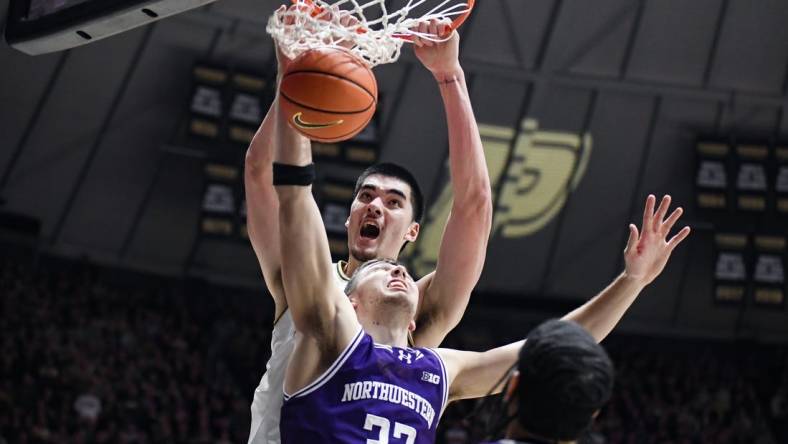 Jan 31, 2024; West Lafayette, Indiana, USA; Purdue Boilermakers center Zach Edey (15) dunks the ball on Northwestern Wildcats forward Blake Preston (32) during the second half at Mackey Arena. Mandatory Credit: Robert Goddin-USA TODAY Sports