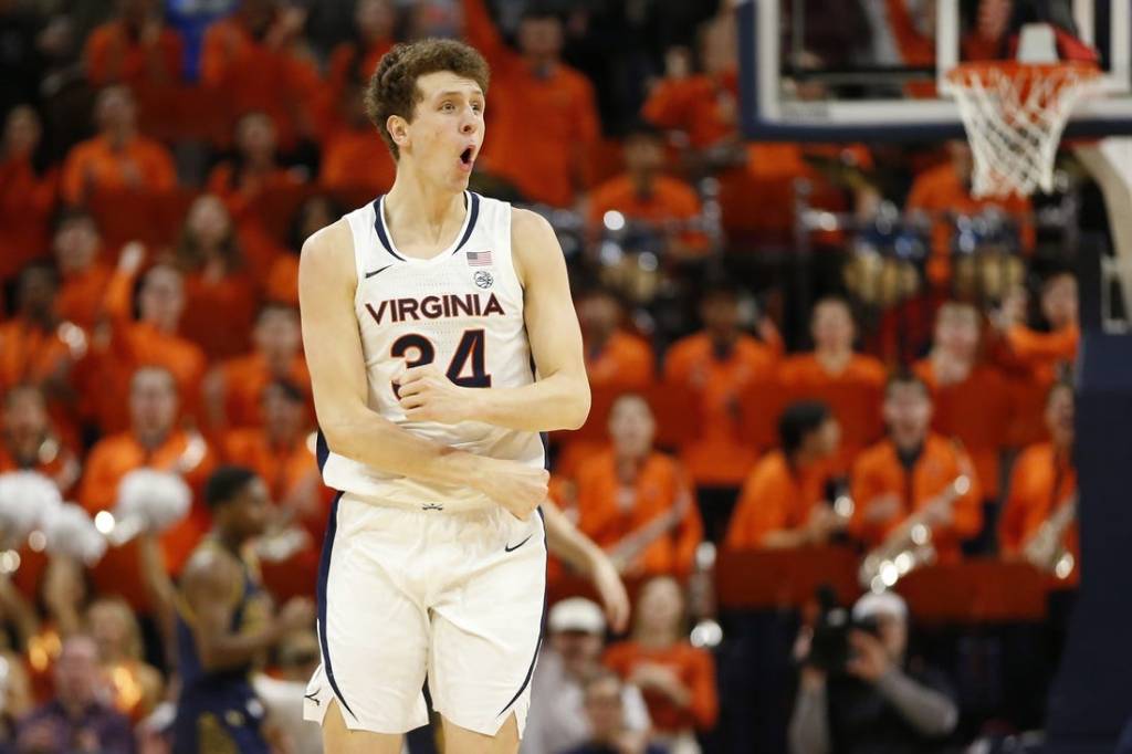 Jan 31, 2024; Charlottesville, Virginia, USA; Virginia Cavaliers forward Jacob Groves (34) celebrates after scoring against the Notre Dame Fighting Irish during the first half at John Paul Jones Arena. Mandatory Credit: Amber Searls-USA TODAY Sports