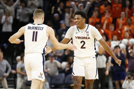 Jan 31, 2024; Charlottesville, Virginia, USA; Virginia Cavaliers guard Isaac McKneely (11) celebrates with Cavaliers guard Reece Beekman (2) after scoring against the Notre Dame Fighting Irish during the first half at John Paul Jones Arena. Mandatory Credit: Amber Searls-USA TODAY Sports