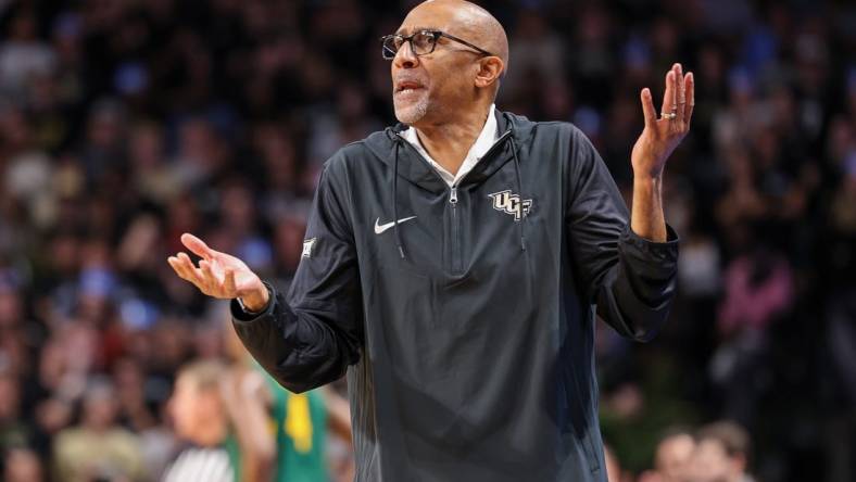 Jan 31, 2024; Orlando, Florida, USA; UCF Knights head coach Johnny Dawkins reacts to a call during the first half against the Baylor Bears at Addition Financial Arena. Mandatory Credit: Mike Watters-USA TODAY Sports