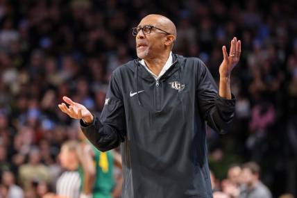 Jan 31, 2024; Orlando, Florida, USA; UCF Knights head coach Johnny Dawkins reacts to a call during the first half against the Baylor Bears at Addition Financial Arena. Mandatory Credit: Mike Watters-USA TODAY Sports