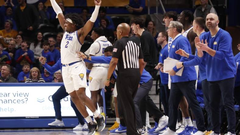 Jan 31, 2024; Pittsburgh, Pennsylvania, USA; Pittsburgh Panthers forward Blake Hinson (2) celebrates a three point basket in front of the PITT bench against the Wake Forest Demon Deacons during the second half at the Petersen Events Center. Pittsburgh won 77-72. Mandatory Credit: Charles LeClaire-USA TODAY Sports