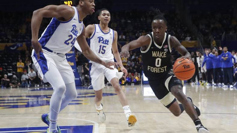 Jan 31, 2024; Pittsburgh, Pennsylvania, USA; Wake Forest Demon Deacons guard Kevin Miller (0) drives to the basket past Pittsburgh Panthers forward William Jeffress (24) and guard Jaland Lowe (15) during the second half at the Petersen Events Center. Pittsburgh won 77-72. Mandatory Credit: Charles LeClaire-USA TODAY Sports