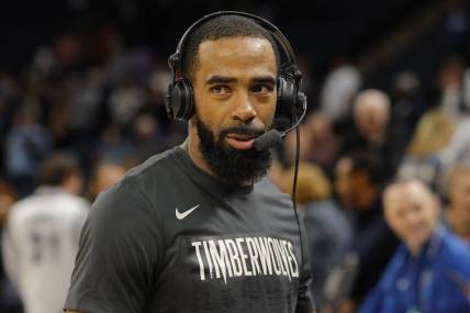 Jan 31, 2024; Minneapolis, Minnesota, USA; Minnesota Timberwolves guard Mike Conley (10) takes part in an interview after defeating the Dallas Mavericks at Target Center. Mandatory Credit: Bruce Kluckhohn-USA TODAY Sports