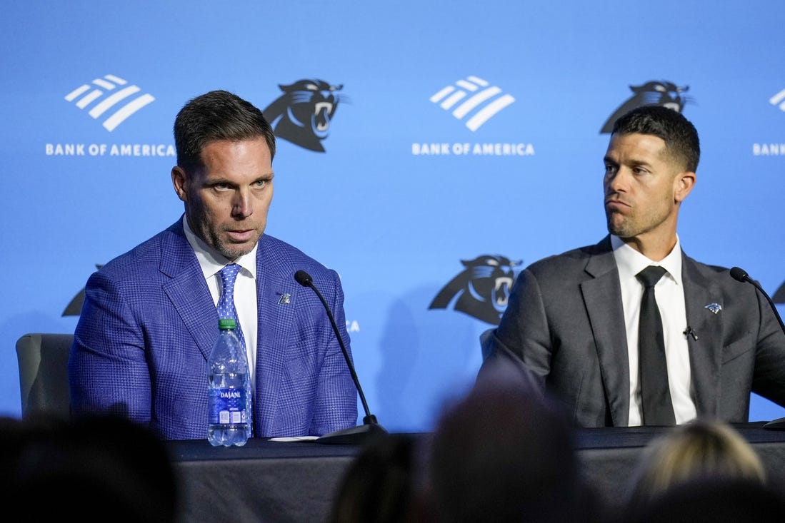 Feb 1, 2024; Charlotte, NC, USA; Carolina Panthers general manager Dan Morgan (left) speaks with new coach Dave Canales during the introductory press conference at Bank of America Stadium. Mandatory Credit: Jim Dedmon-USA TODAY Sports