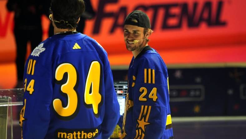 Feb 1, 2024; Toronto, Ontario, CANADA; Team Matthews celebrity coach Justin Bieber (24) talks to Team Matthews captain Auston Matthews during the NHL All-Star Player Draft on NHL All-Star Thursday at Scotiabank Arena. Mandatory Credit: John E. Sokolowski-USA TODAY Sports