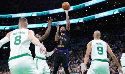 Feb 1, 2024; Boston, Massachusetts, USA; Los Angeles Lakers guard D'Angelo Russell (1) shoots against the Boston Celtics in the first quarter at TD Garden. Mandatory Credit: David Butler II-USA TODAY Sports