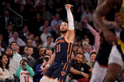 Feb 1, 2024; New York, New York, USA; New York Knicks guard Jalen Brunson (11) watches his three point shot against the Indiana Pacers during the fourth quarter at Madison Square Garden. Mandatory Credit: Brad Penner-USA TODAY Sports
