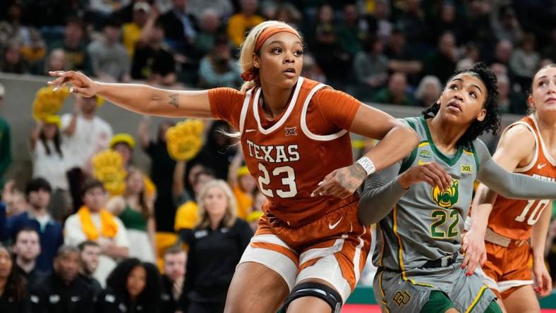 Feb 1, 2024; Waco, Texas, USA; Texas Longhorns forward Aaliyah Moore (23) and Baylor Lady Bears guard Bella Fontleroy (22) battle for position during the second half at Paul and Alejandra Foster Pavilion. Mandatory Credit: Chris Jones-USA TODAY Sports