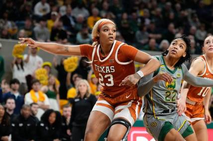 Feb 1, 2024; Waco, Texas, USA; Texas Longhorns forward Aaliyah Moore (23) and Baylor Lady Bears guard Bella Fontleroy (22) battle for position during the second half at Paul and Alejandra Foster Pavilion. Mandatory Credit: Chris Jones-USA TODAY Sports