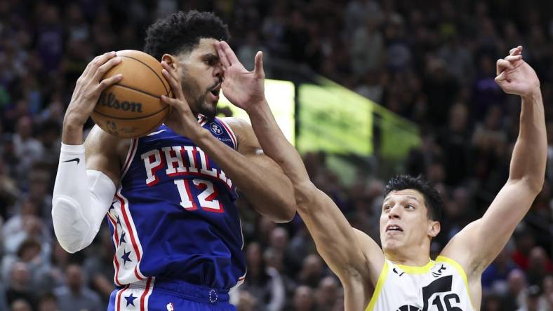 Feb 1, 2024; Salt Lake City, Utah, USA; Philadelphia 76ers forward Tobias Harris (12) is fouled by Utah Jazz forward Simone Fontecchio (16) during the fourth quarter at Delta Center. Mandatory Credit: Rob Gray-USA TODAY Sports