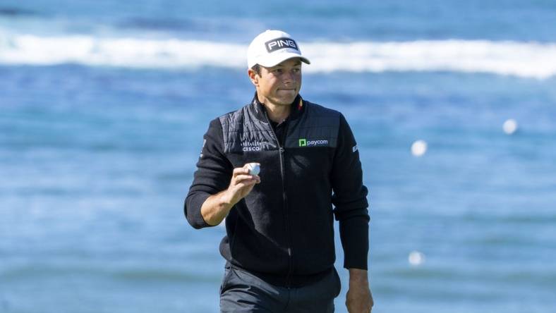 February 2, 2024; Pebble Beach, California, USA; Viktor Hovland acknowledges the crowd after making his putt on the fifth hole during the second round of the AT&T Pebble Beach Pro-Am golf tournament at Pebble Beach Golf Links. Mandatory Credit: Kyle Terada-USA TODAY Sports