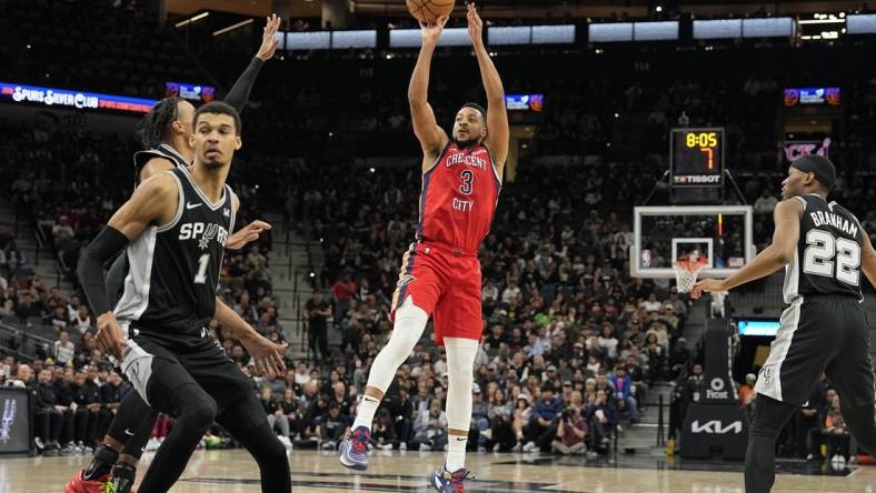 Feb 2, 2024; San Antonio, Texas, USA; New Orleans Pelicans guard CJ McCollum (3) shoots during the first half against the San Antonio Spurs at Frost Bank Center. Mandatory Credit: Scott Wachter-USA TODAY Sports