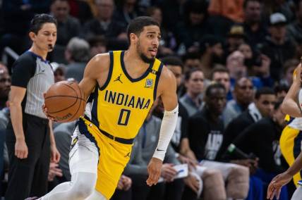 Feb 2, 2024; Indianapolis, Indiana, USA; Indiana Pacers guard Tyrese Haliburton (0) dribbles the ball in the second half against the Sacramento Kings at Gainbridge Fieldhouse. Mandatory Credit: Trevor Ruszkowski-USA TODAY Sports