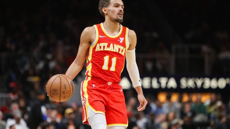 Feb 2, 2024; Atlanta, Georgia, USA; Atlanta Hawks guard Trae Young (11) dribbles against the Phoenix Suns in the second half at State Farm Arena. Mandatory Credit: Brett Davis-USA TODAY Sports