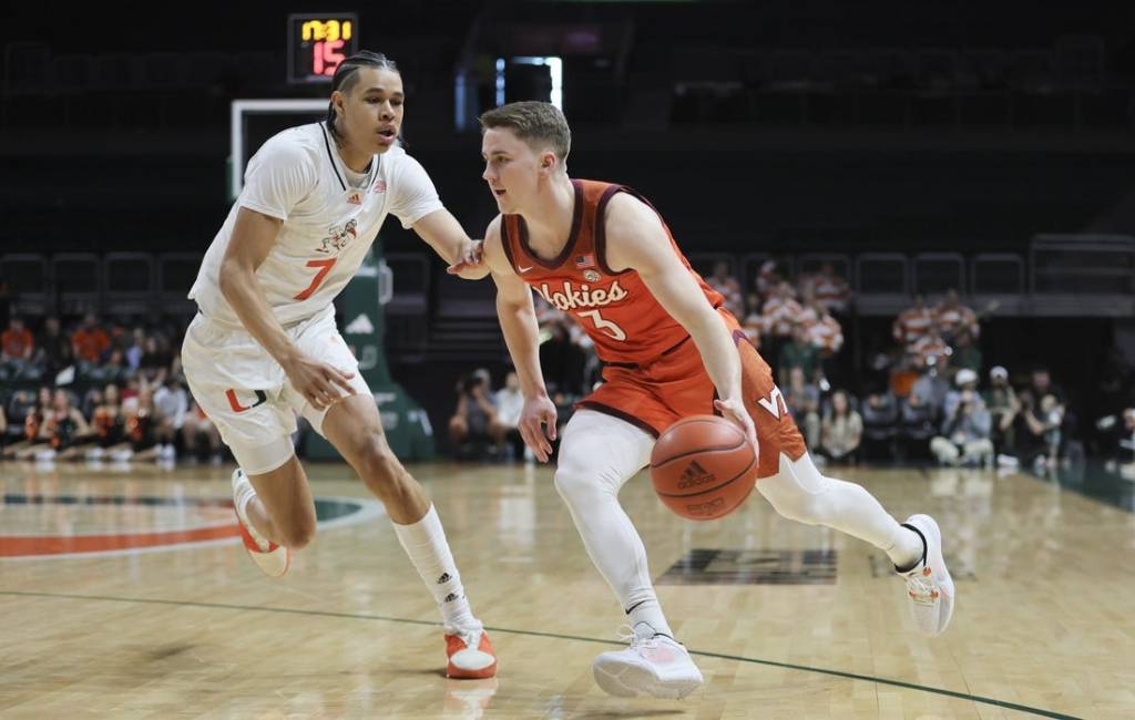 Feb 3, 2024; Coral Gables, Florida, USA; Virginia Tech Hokies guard Sean Pedulla (3) drives to the basket past Miami Hurricanes guard Kyshawn George (7) during the first half at Watsco Center. Mandatory Credit: Sam Navarro-USA TODAY Sports