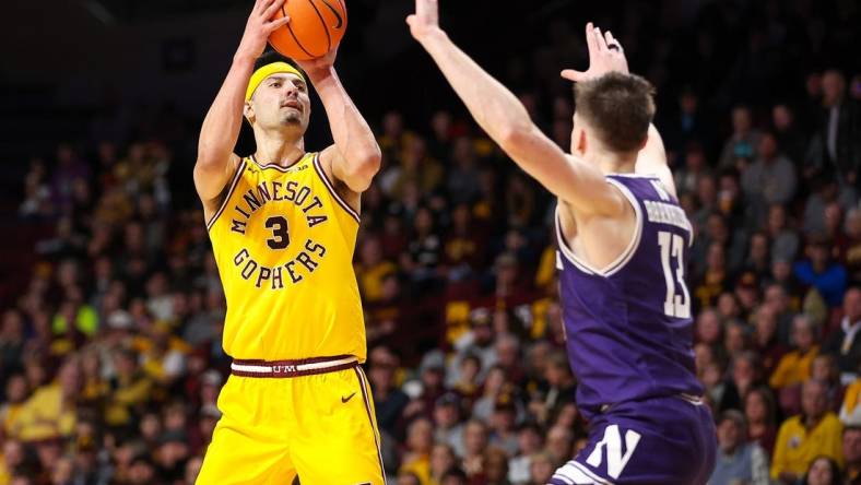 Feb 3, 2024; Minneapolis, Minnesota, USA; Minnesota Golden Gophers forward Dawson Garcia (3) shoots as Northwestern Wildcats guard Brooks Barnhizer (13) defends during the first half at Williams Arena. Mandatory Credit: Matt Krohn-USA TODAY Sports