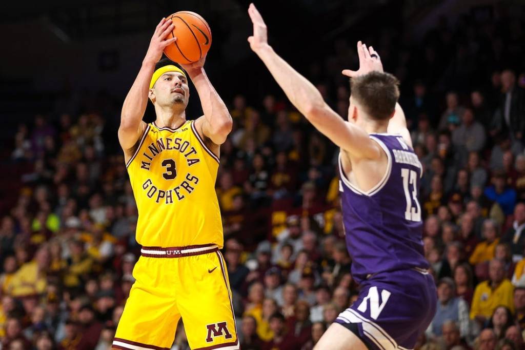 Feb 3, 2024; Minneapolis, Minnesota, USA; Minnesota Golden Gophers forward Dawson Garcia (3) shoots as Northwestern Wildcats guard Brooks Barnhizer (13) defends during the first half at Williams Arena. Mandatory Credit: Matt Krohn-USA TODAY Sports