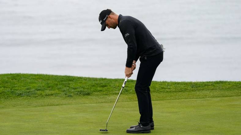 Feb 3, 2024; Pebble Beach, California, USA; Wyndham Clark putts on the fifth hole during the third round of the AT&T Pebble Beach Pro-Am golf tournament at Pebble Beach Golf Links. Mandatory Credit: Michael Madrid-USA TODAY Sports