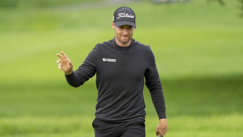 February 3, 2024; Pebble Beach, California, USA; Wyndham Clark acknowledges the crowd after making his putt on the second hole during the third round of the AT&T Pebble Beach Pro-Am golf tournament at Pebble Beach Golf Links. Mandatory Credit: Kyle Terada-USA TODAY Sports