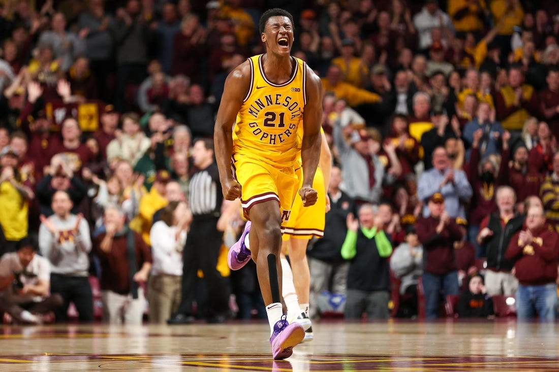 Feb 3, 2024; Minneapolis, Minnesota, USA; Minnesota Golden Gophers forward Pharrel Payne (21) celebrates his dunk against the Northwestern Wildcats during overtime at Williams Arena. Mandatory Credit: Matt Krohn-USA TODAY Sports