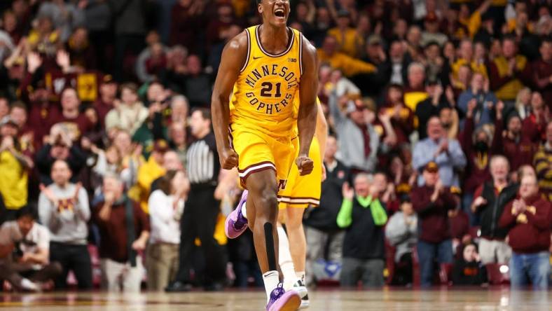 Feb 3, 2024; Minneapolis, Minnesota, USA; Minnesota Golden Gophers forward Pharrel Payne (21) celebrates his dunk against the Northwestern Wildcats during overtime at Williams Arena. Mandatory Credit: Matt Krohn-USA TODAY Sports