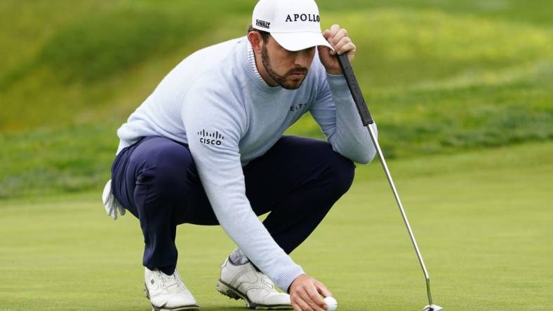 Feb 3, 2024; Pebble Beach, California, USA; Patrick Cantlay lines up his putt on the fifth hole during the third round of the AT&T Pebble Beach Pro-Am golf tournament at Pebble Beach Golf Links. Mandatory Credit: Michael Madrid-USA TODAY Sports