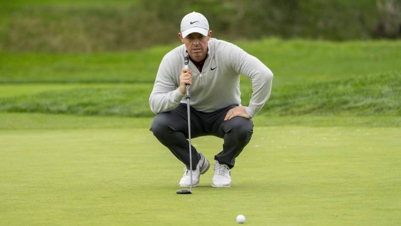 February 3, 2024; Pebble Beach, California, USA; Rory McIlroy lines up his putt on the second hole during the third round of the AT&T Pebble Beach Pro-Am golf tournament at Pebble Beach Golf Links. Mandatory Credit: Kyle Terada-USA TODAY Sports