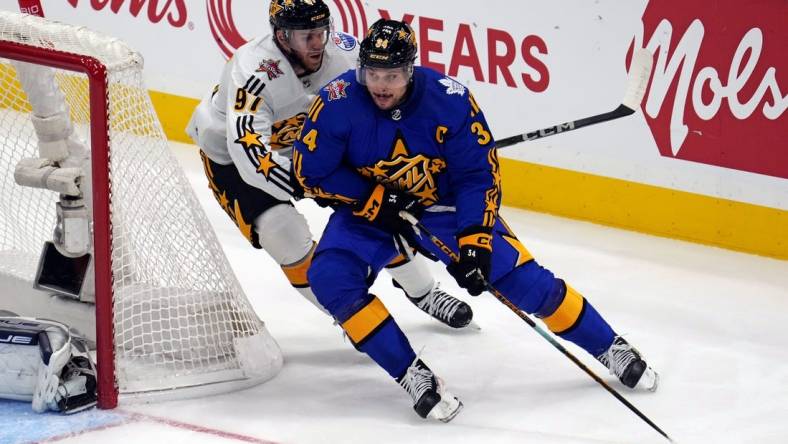 Feb 3, 2024; Toronto, Ontario, CAN; Team Matthews center Auston Matthews (34) of the Toronto Maple Leafs moves the puck against Team McDavid center Connor McDavid (97) of the Edmonton Oilers in the 2024 NHL All-Star Game at Scotiabank Arena. Mandatory Credit: John E. Sokolowski-USA TODAY Sports