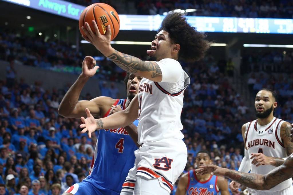 Feb 3, 2024; Oxford, Mississippi, USA; Auburn Tigers guard Tre Donaldson (3) drives to the basket during the first half against the Mississippi Rebels at The Sandy and John Black Pavilion at Ole Miss. Mandatory Credit: Petre Thomas-USA TODAY Sports