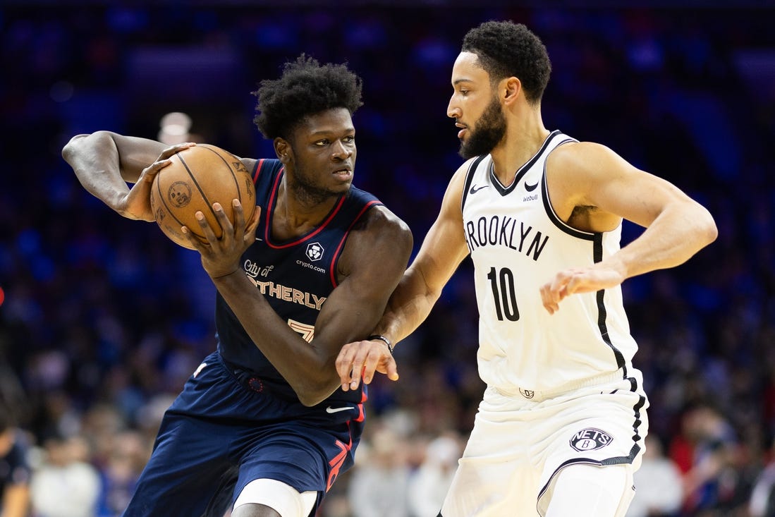 Feb 3, 2024; Philadelphia, Pennsylvania, USA; Philadelphia 76ers center Mo Bamba (7) controls the ball against Brooklyn Nets guard Ben Simmons (10) during the second quarter at Wells Fargo Center. Mandatory Credit: Bill Streicher-USA TODAY Sports