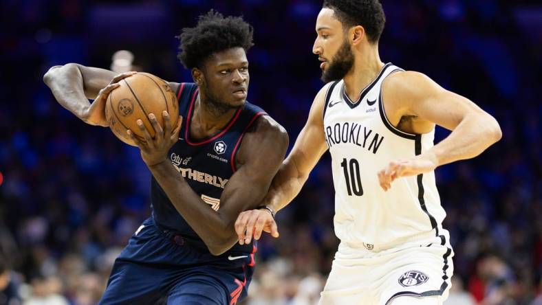 Feb 3, 2024; Philadelphia, Pennsylvania, USA; Philadelphia 76ers center Mo Bamba (7) controls the ball against Brooklyn Nets guard Ben Simmons (10) during the second quarter at Wells Fargo Center. Mandatory Credit: Bill Streicher-USA TODAY Sports