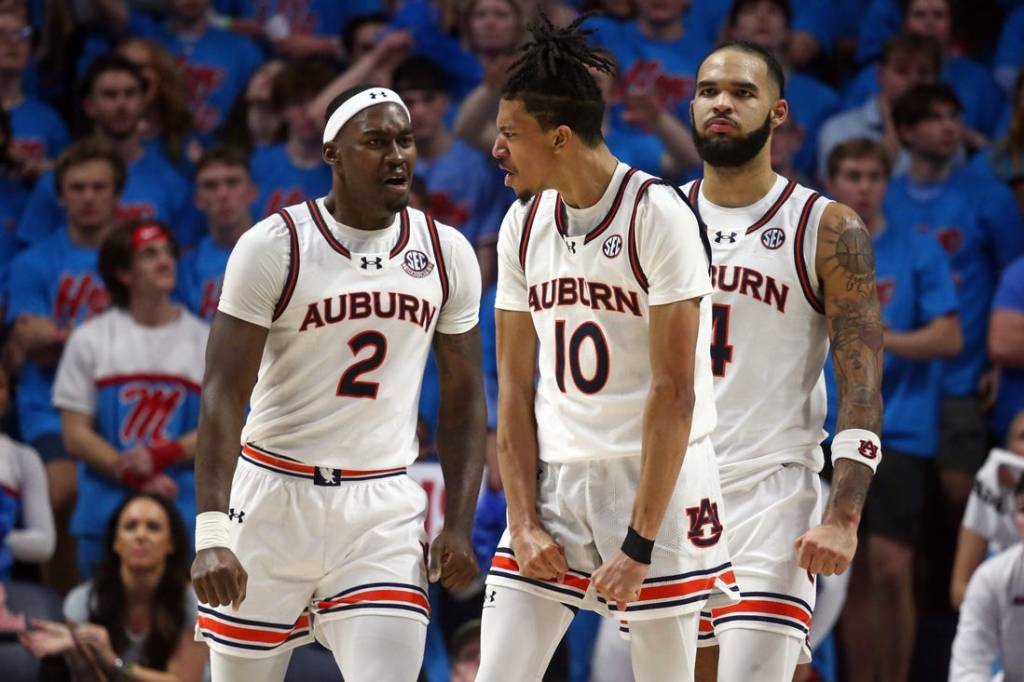 Feb 3, 2024; Oxford, Mississippi, USA; Auburn Tigers guard/forward Chad Baker-Mazara (10) reacts with forward Jaylin Williams (2) and forward/center Johni Broome (4) after a dunk during the second half against the Mississippi Rebels at The Sandy and John Black Pavilion at Ole Miss. Mandatory Credit: Petre Thomas-USA TODAY Sports