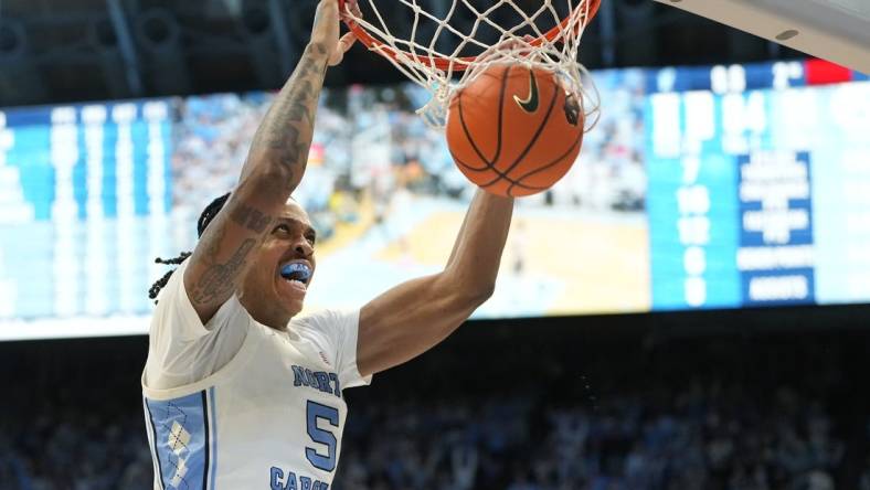 Feb 3, 2024; Chapel Hill, North Carolina, USA;  North Carolina Tar Heels forward Armando Bacot (5) scores in the second half at Dean E. Smith Center. Mandatory Credit: Bob Donnan-USA TODAY Sports