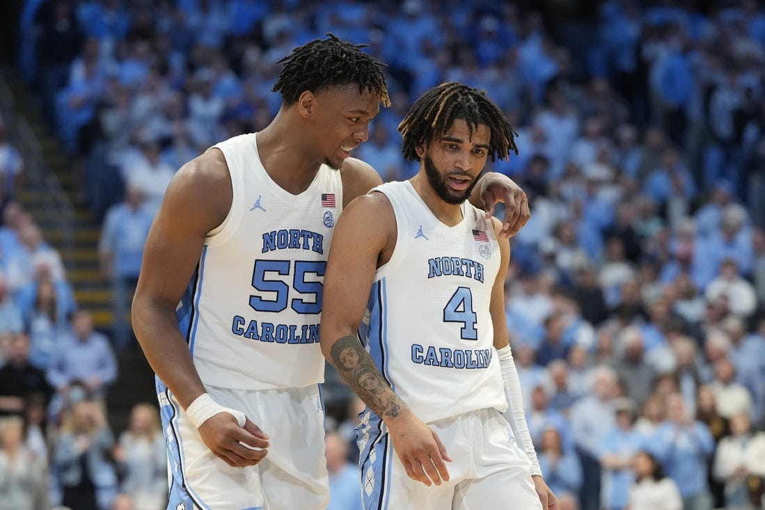 Feb 3, 2024; Chapel Hill, North Carolina, USA; North Carolina Tar Heels forward Harrison Ingram (55) and guard RJ Davis (4) in the second half at Dean E. Smith Center. Mandatory Credit: Bob Donnan-USA TODAY Sports