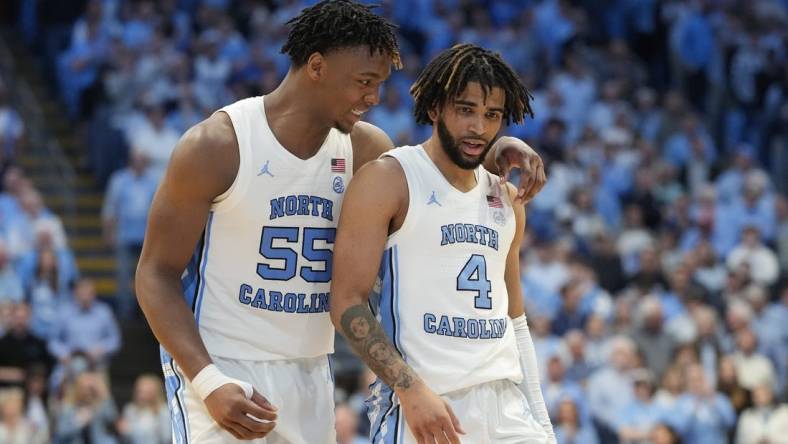 Feb 3, 2024; Chapel Hill, North Carolina, USA; North Carolina Tar Heels forward Harrison Ingram (55) and guard RJ Davis (4) in the second half at Dean E. Smith Center. Mandatory Credit: Bob Donnan-USA TODAY Sports