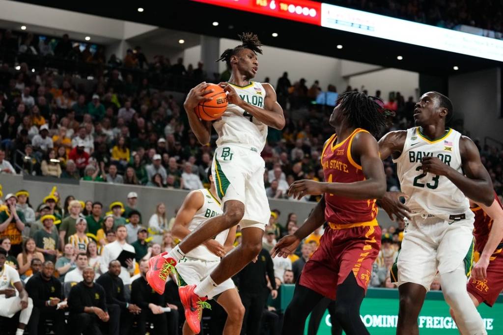 Feb 3, 2024; Waco, Texas, USA; Baylor Bears guard Ja'Kobe Walter (4) grabs a rebound against the Iowa State Cyclones during the first half at Paul and Alejandra Foster Pavilion. Mandatory Credit: Chris Jones-USA TODAY Sports