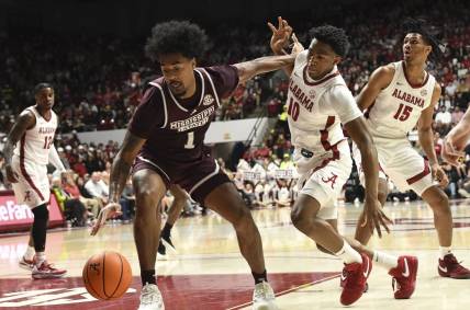 Feb 3, 2024; Tuscaloosa, Alabama, USA;  Mississippi State forward Tolu Smith III (1) pushes away Alabama forward Mouhamed Dioubate (10) as he makes a move to the basket at Coleman Coliseum. Mandatory Credit: Gary Cosby Jr.-USA TODAY Sports