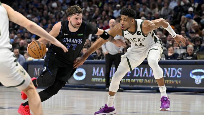 Feb 3, 2024; Dallas, Texas, USA; Dallas Mavericks guard Luka Doncic (77) drives to the basket past Milwaukee Bucks forward Giannis Antetokounmpo (34) during the second quarter at the American Airlines Center. Mandatory Credit: Jerome Miron-USA TODAY Sports