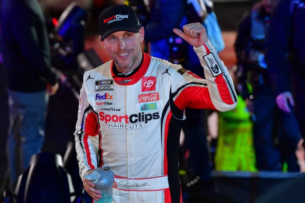 Feb 3, 2024; Los Angeles, California, USA;  NASCAR Cup Series driver Denny Hamlin (11) celebrates his victory of the Busch Light Clash at Los Angeles Memorial Coliseum. Mandatory Credit: Gary A. Vasquez-USA TODAY Sports