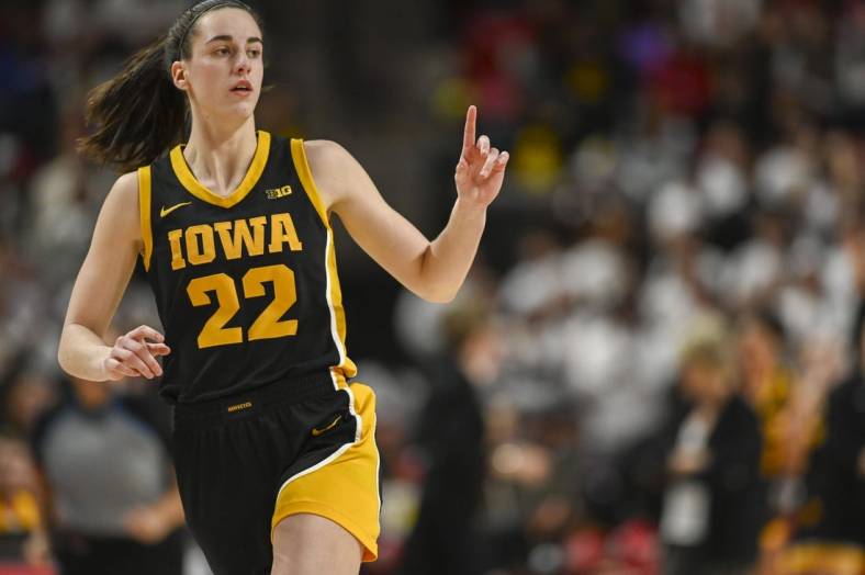 Feb 3, 2024; College Park, Maryland, USA;  Iowa Hawkeyes guard Caitlin Clark (22) reacts after making a three point basket during the second half against the Maryland Terrapins at Xfinity Center. Mandatory Credit: Tommy Gilligan-USA TODAY Sports
