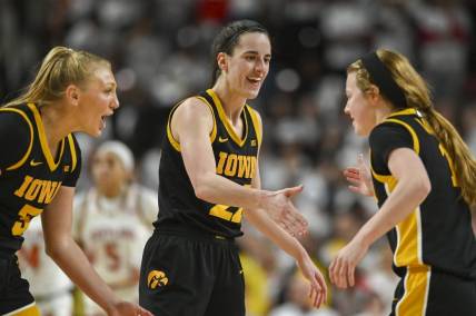 Feb 3, 2024; College Park, Maryland, USA;  Iowa Hawkeyes guard Caitlin Clark (22) celebrates with  guard Sydney Affolter (3) and  guard Molly Davis (1) during the second half against the Maryland Terrapins at Xfinity Center. Mandatory Credit: Tommy Gilligan-USA TODAY Sports
