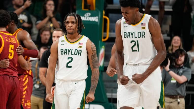 Feb 3, 2024; Waco, Texas, USA; Baylor Bears guard Jayden Nunn (2) and Baylor Bears center Yves Missi (21) reacts after Baylor Bears guard Jayden Nunn (2) scores and is fouled in the closing moments against the  Iowa State Cyclones at Paul and Alejandra Foster Pavilion. Mandatory Credit: Chris Jones-USA TODAY Sports