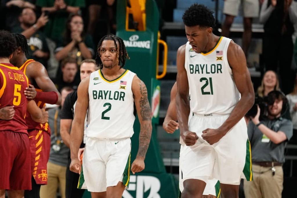 Feb 3, 2024; Waco, Texas, USA; Baylor Bears guard Jayden Nunn (2) and Baylor Bears center Yves Missi (21) reacts after Baylor Bears guard Jayden Nunn (2) scores and is fouled in the closing moments against the  Iowa State Cyclones at Paul and Alejandra Foster Pavilion. Mandatory Credit: Chris Jones-USA TODAY Sports