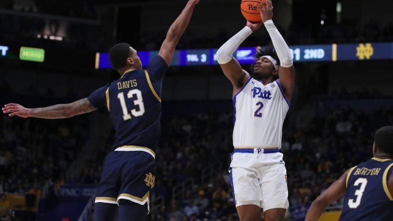 Pittsburgh Panthers Blake Hinson (2) attempts a three point shot over the head of Notre Dame Fighting Irish Tae Davis (13) during the second half on February 3, 2024 at the Petersen Events Center in Pittsburgh, PA.